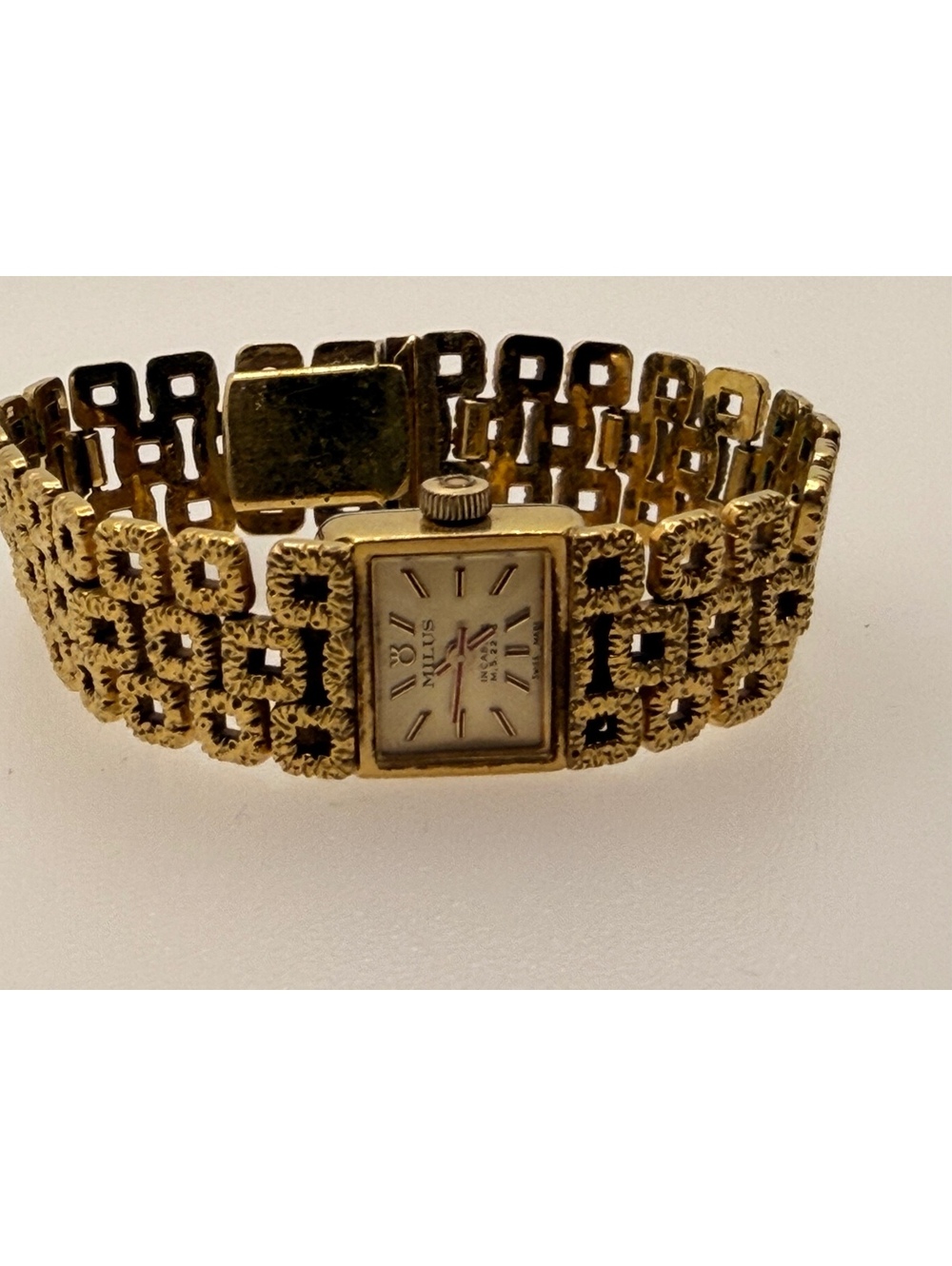 Gold tone bracelet watch